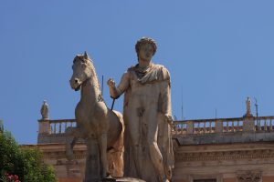 A majestic Roman statue of a man and horse under clear blue sky. — Julius Caesar The Man Who Changed Rome Forever