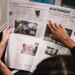 People reading a newspaper on a subway train, highlighting current events and diverse perspectives. — MyStake Casino: Snelle